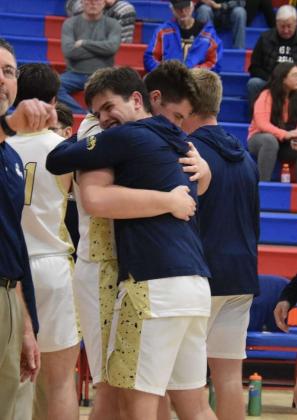 Ben Marrs (blue hoodie) hugs his brother Jason Marrs. (Photo: Eva Matteucci)