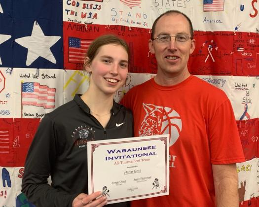 Hattie Gros is pictured with her father, Wayne, a Wabaunsee High School alum, after last night's overtime win. (Courtesy Photo)