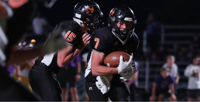 Max Neeley takes a handoff during a game last fall. (Photo: Everett Royer/KSportsImages.com)