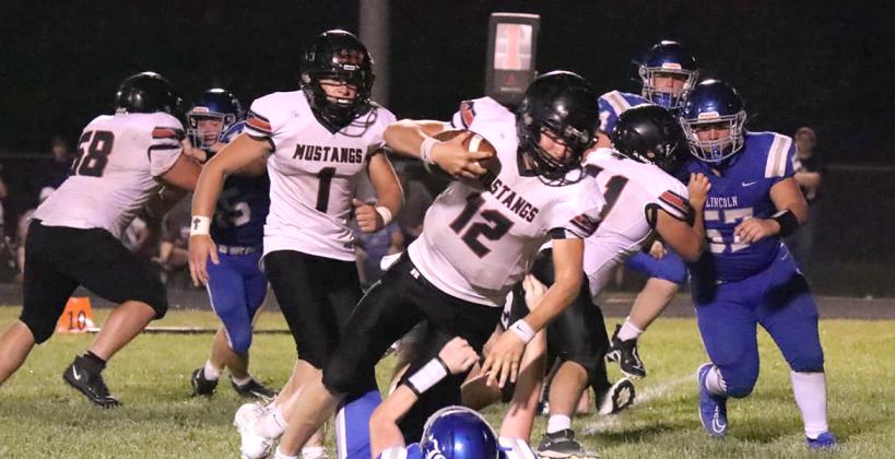 Sylvan-Lucas has nearly 40 players out for 8-Man football after gaining a number of students following the Wilson school closure and the Mustangs looks like an 8-Man II contender after a hard-fought win over a much-improved Lincoln team Friday night. (Photo: Lori Spear)