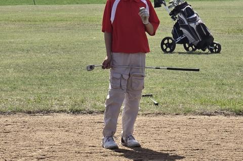 Layd'n Hinderliter on his final hole waiting to putt at McCracken's sand green golf course. (Photo: Submitted)