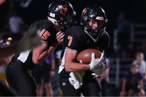 Max Neeley takes a handoff during a game last fall. (Photo: Everett Royer/KSportsImages.com)